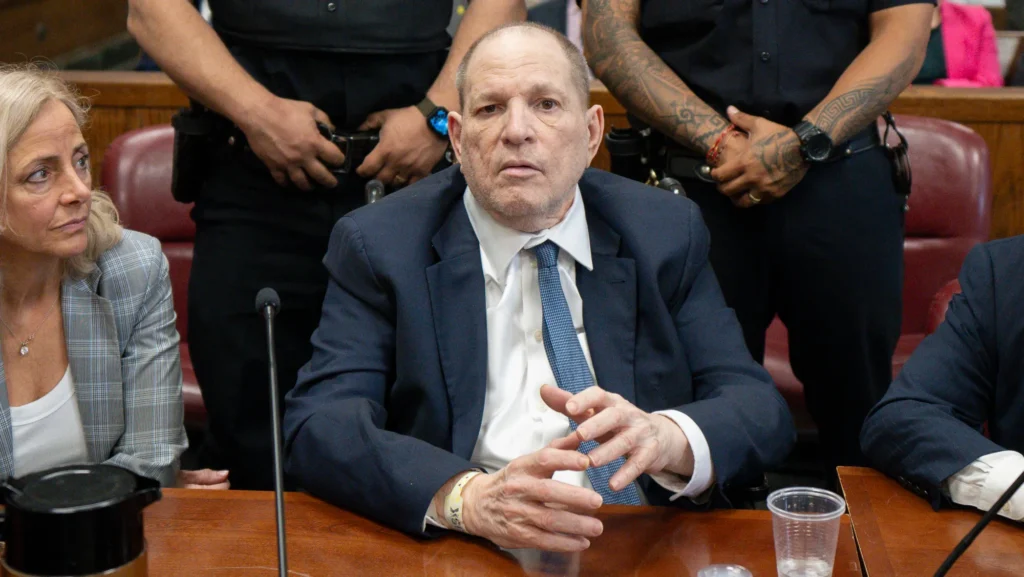 Harvey Weinstein in court during his trial, highlighting the recent mistrial news and sexual assault conviction.